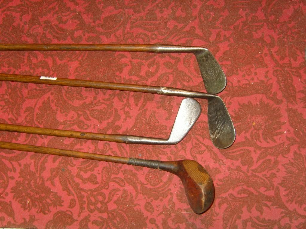 Appraisal: A collection of three hickory shafted golfing irons marked J