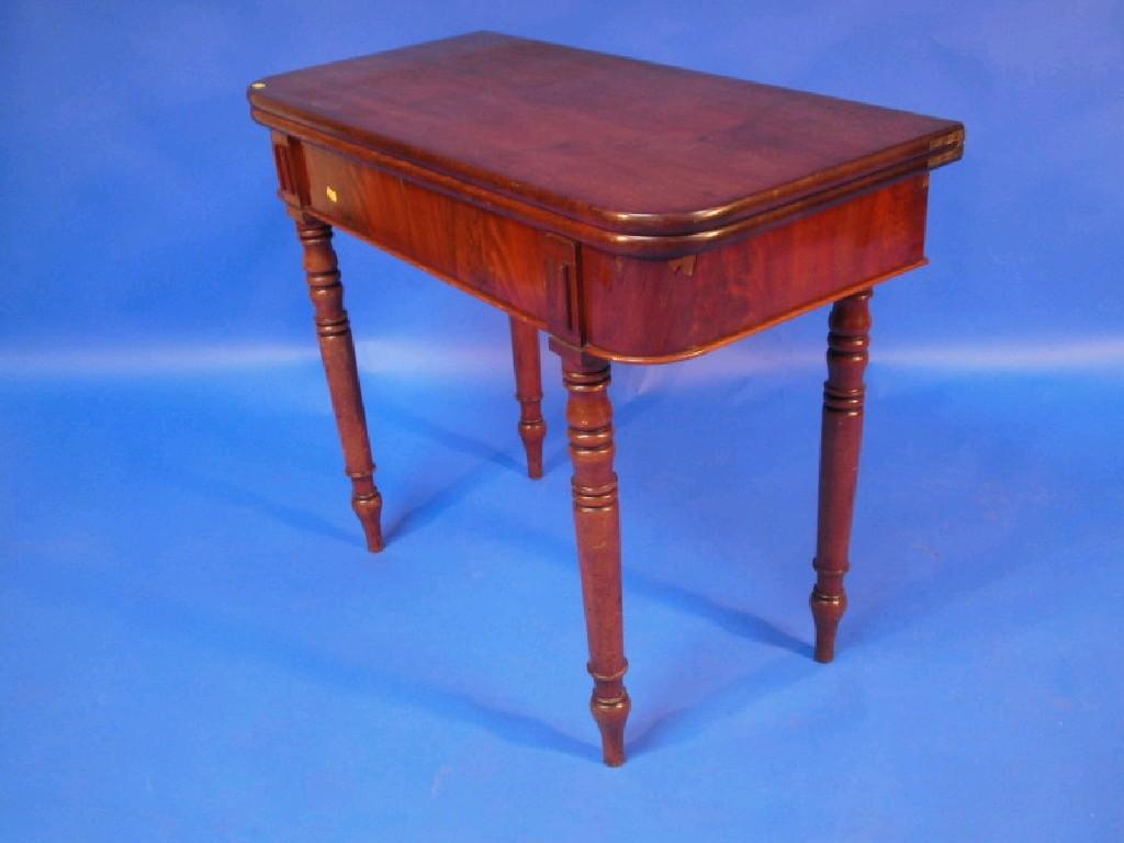 Appraisal: A thC mahogany fold-over tea table with plain frieze raised