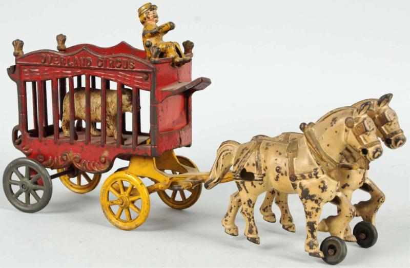 Appraisal: Cast Iron Kenton Horse-Drawn Circus Wagon Toy American Original back