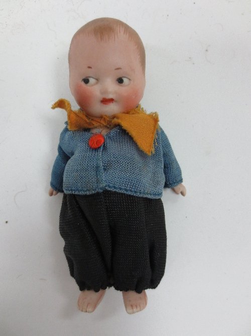 Appraisal: A bisque Googly doll the portly boy looking right with