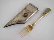 Appraisal: A white metal scabbard mount with yellow metal bead decorated