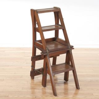 Appraisal: English metamorphic mahogany library ladder English metamorphic mahogany library ladder