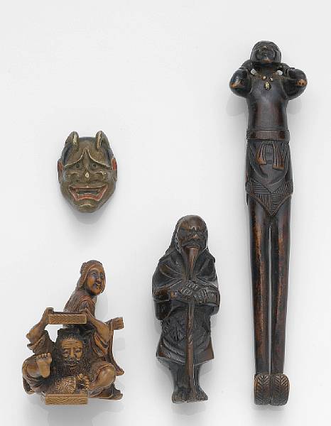 Appraisal: Four small wood carvings Including a dark stained sashi netsuke