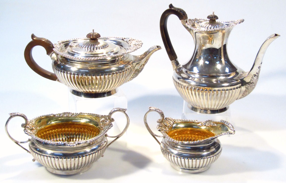 Appraisal: An Edwardian silver and silver gilt four piece tea service