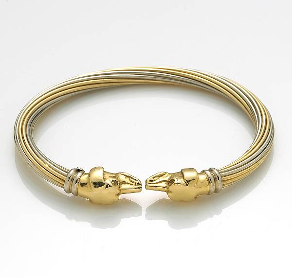 Appraisal: An k bicolor gold dog motif cuff bangle OJ Perrin