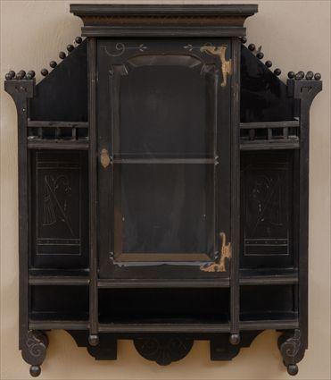 Appraisal: AESTHETIC MOVEMENT EBONIZED AND INCISED HANGING CABINET The covered cornice