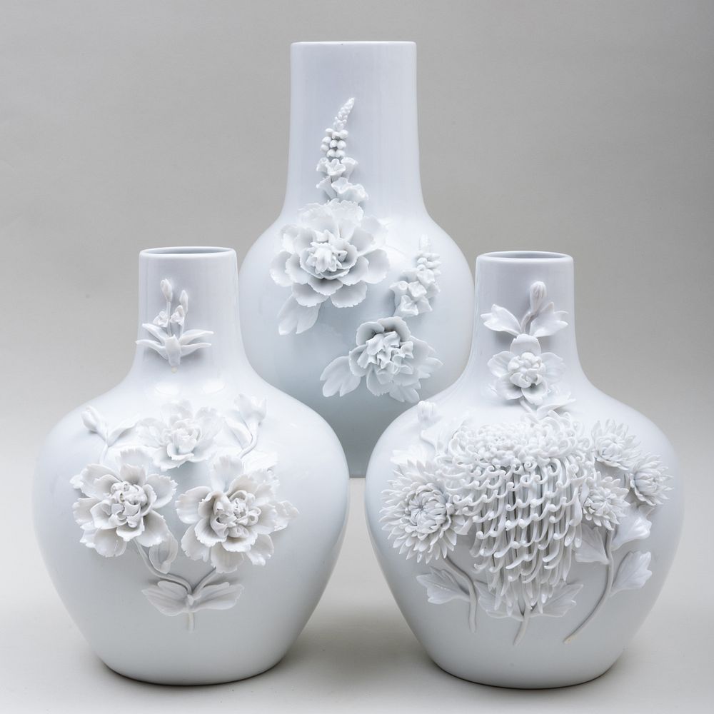 Appraisal: Group of Three Chinese Porcelain Flower Encrusted Vases Unmarked The