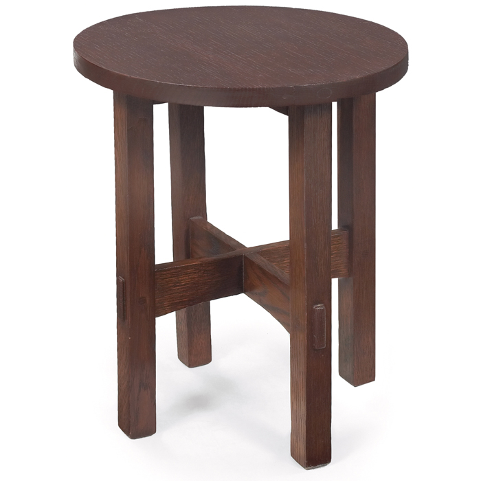 Appraisal: Gustav Stickley tabouret circular top over an arched cross-stretcher base