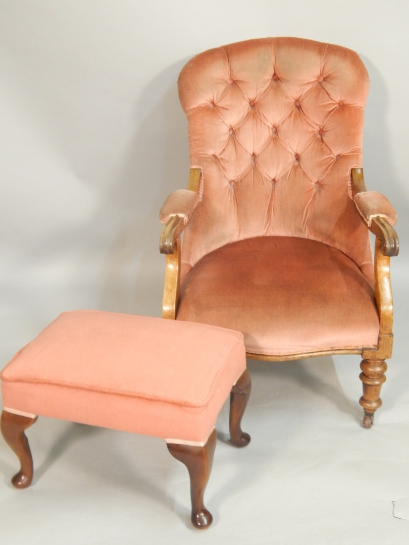 Appraisal: A Victorian rosewood armchair with a button back padded arm