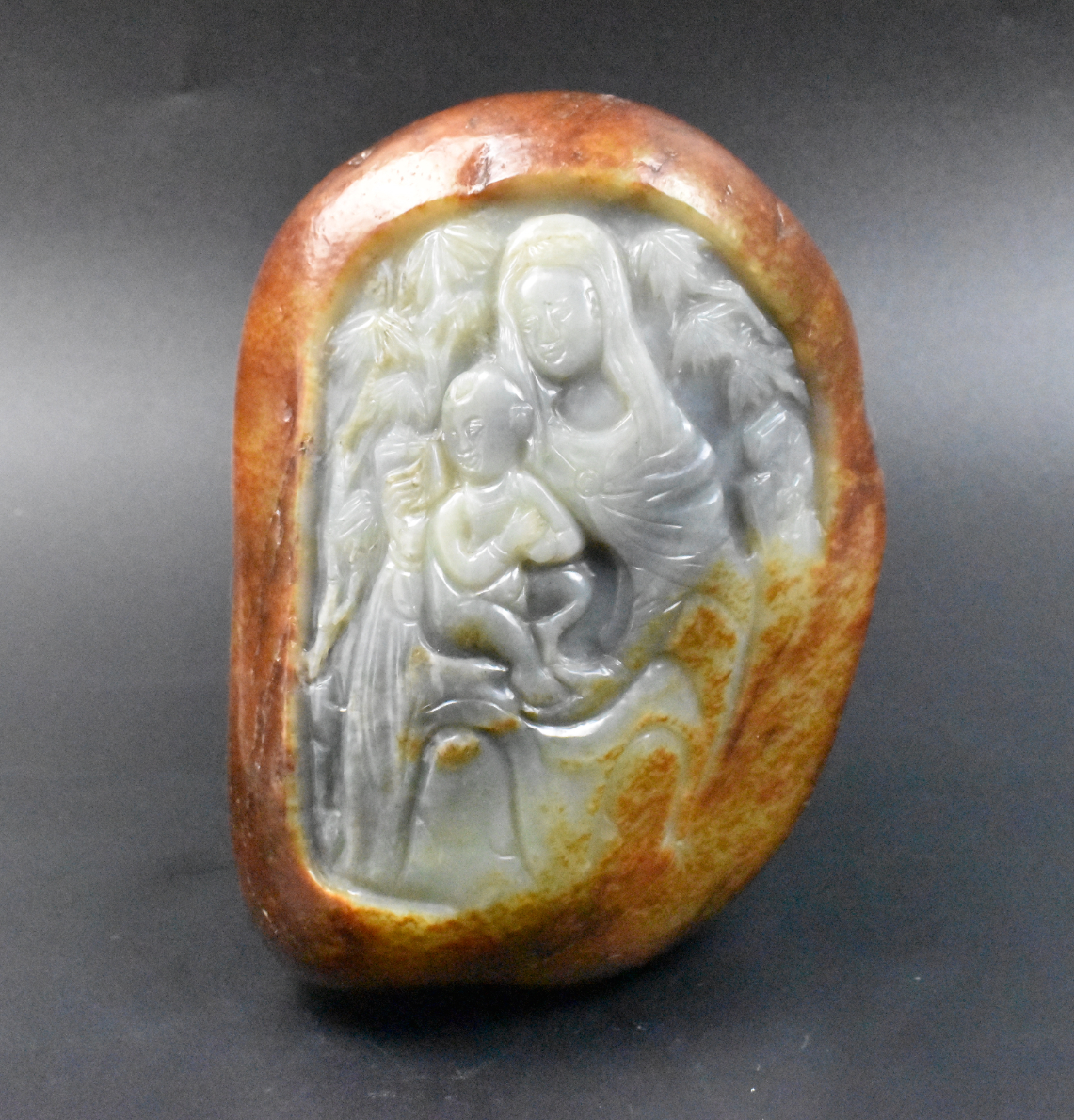 Appraisal: A Carved jade ornament with Guanyin and baby Carved from