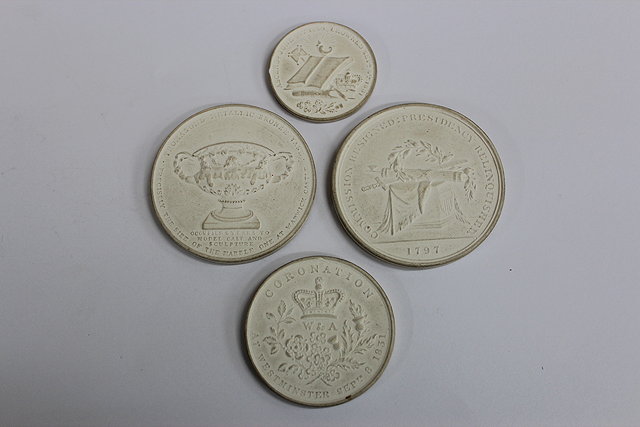 Appraisal: FOUR PLASTER CASTS OF MEDALLIONS the largest cm in diameter