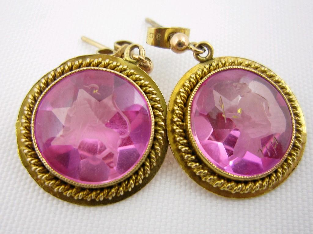 Appraisal: A pair of Ear Pendants each collet-set pink glass engraved