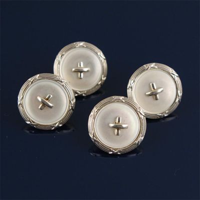 Appraisal: A pair of gold dress cuff links button design mounted