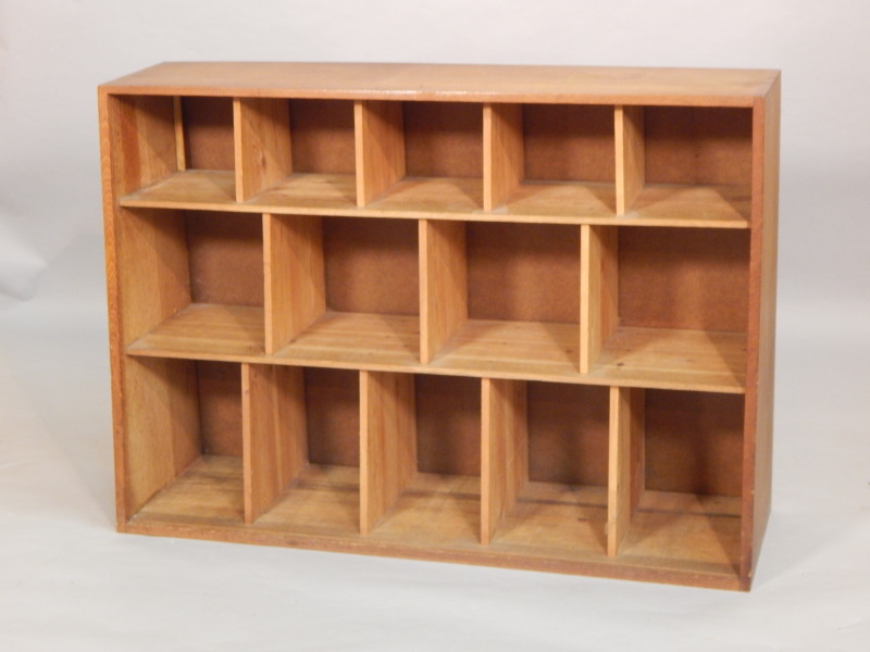 Appraisal: An Art Deco style light oak bookcase with various compartments