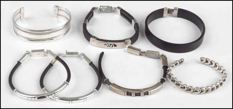 Appraisal: FIVE STERLING SILVER AND BLACK RUBBER BRACELETS Together with two