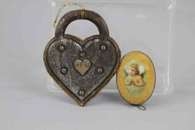 Appraisal: DRESDEN EGG CANDY CONTAINER AND CHERUB LOCK Germany cherubs on