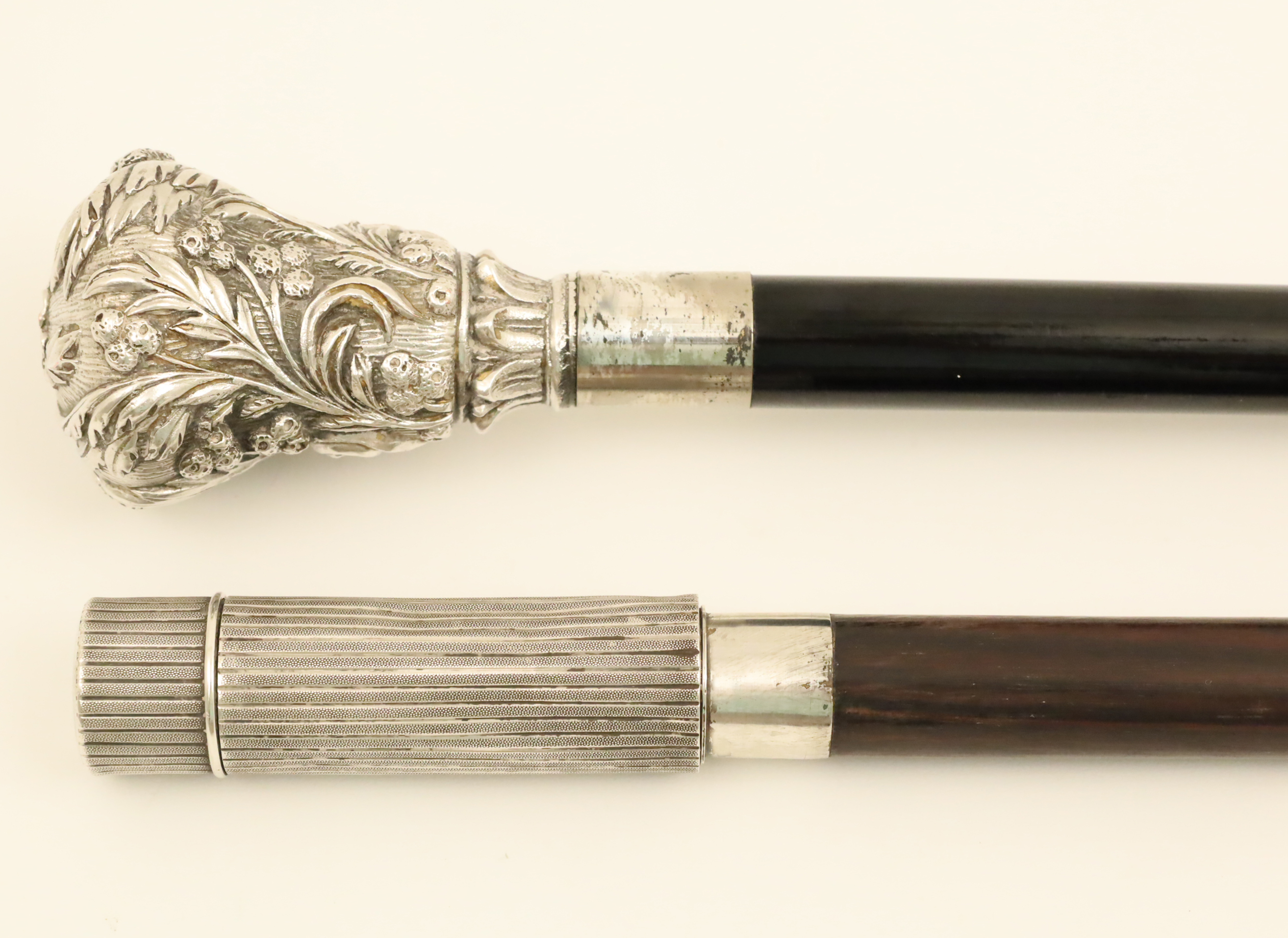 Appraisal: TWO STERLING HANDLE WALKING CANES Two sterling handle walking canes