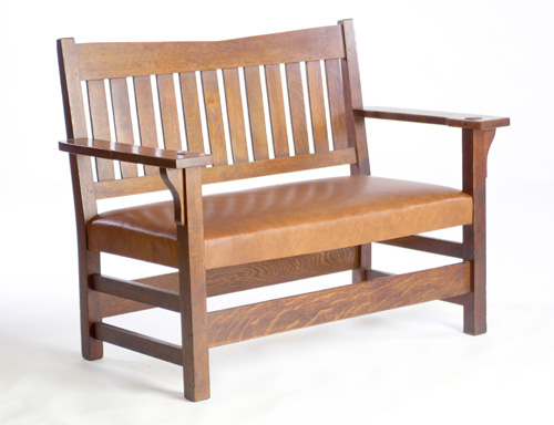 Appraisal: GUSTAV STICKLEY Settee with twelve vertical backslats a V-shaped crestrail