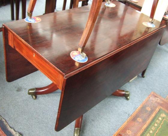 Appraisal: An early th century mahogany drop flap centre table with