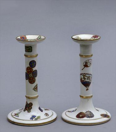 Appraisal: PAIR OF ROYAL WORCESTER AESTHETIC MOVEMENT PORCELAIN CANDLESTICKS Enameled with