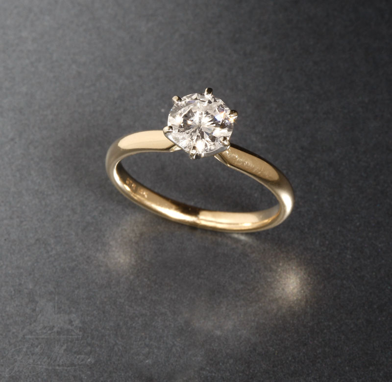 Appraisal: A K yellow gold and diamond single stone ring A