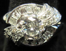 Appraisal: Platinum and diamond ring Round cut diamond approximately carats accented