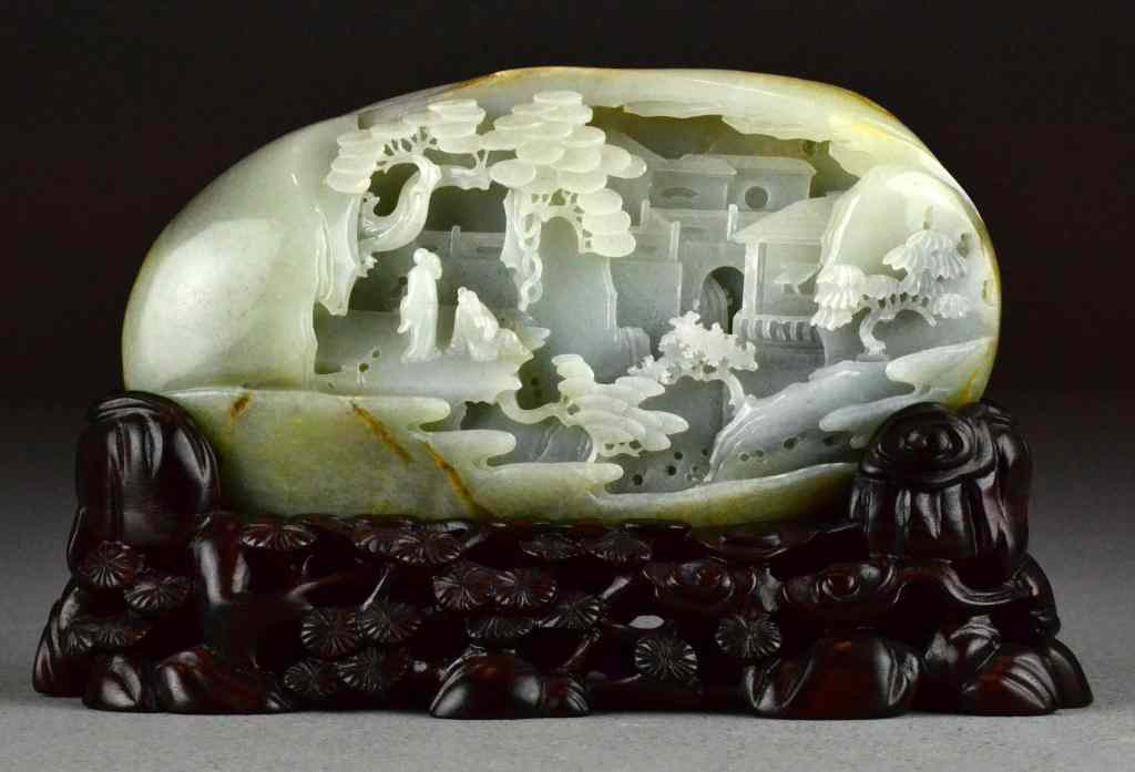 Appraisal: Finely Carved Chinese Jade BoulderThe well carved stone depicting elders