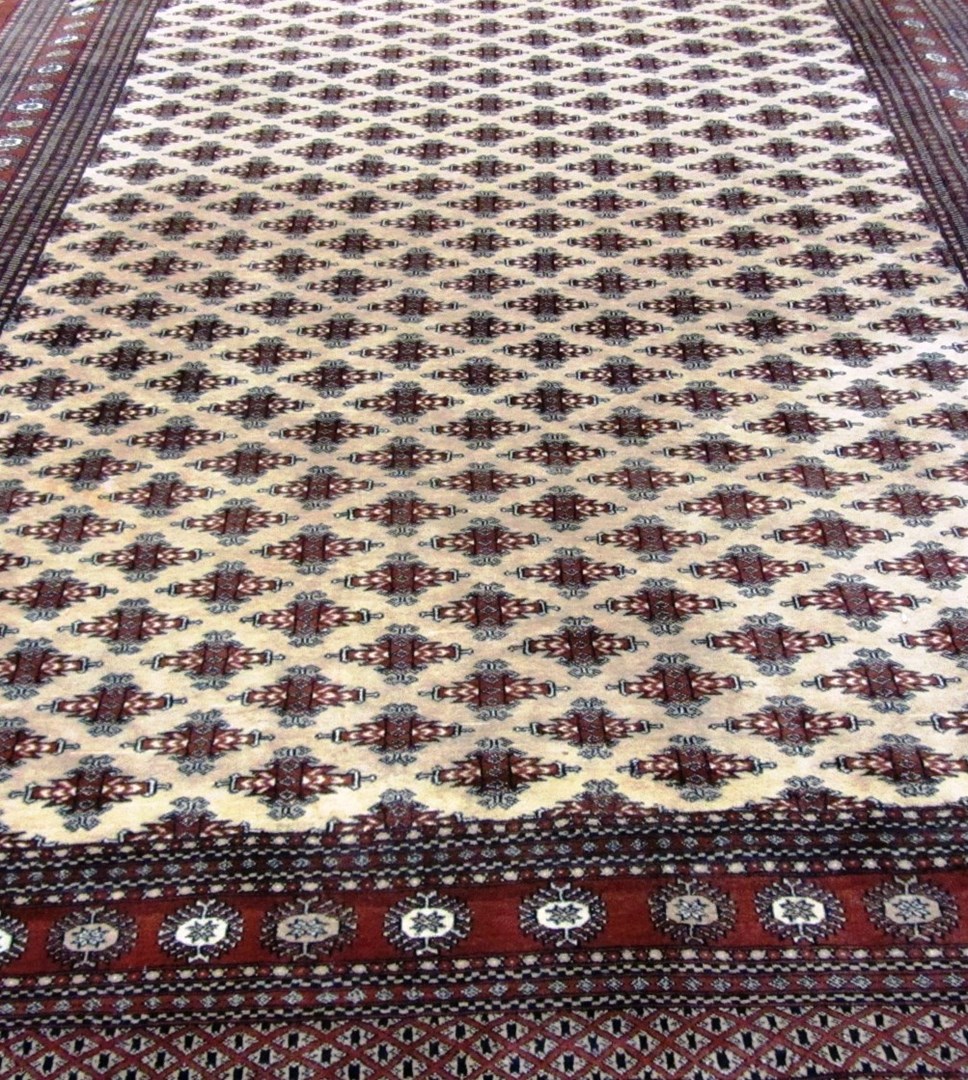 Appraisal: A Pakistan Bokhara carpet the cream field with an allover