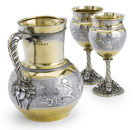 Appraisal: A cased Victorian parcel-gilt silver water jug and matching pair