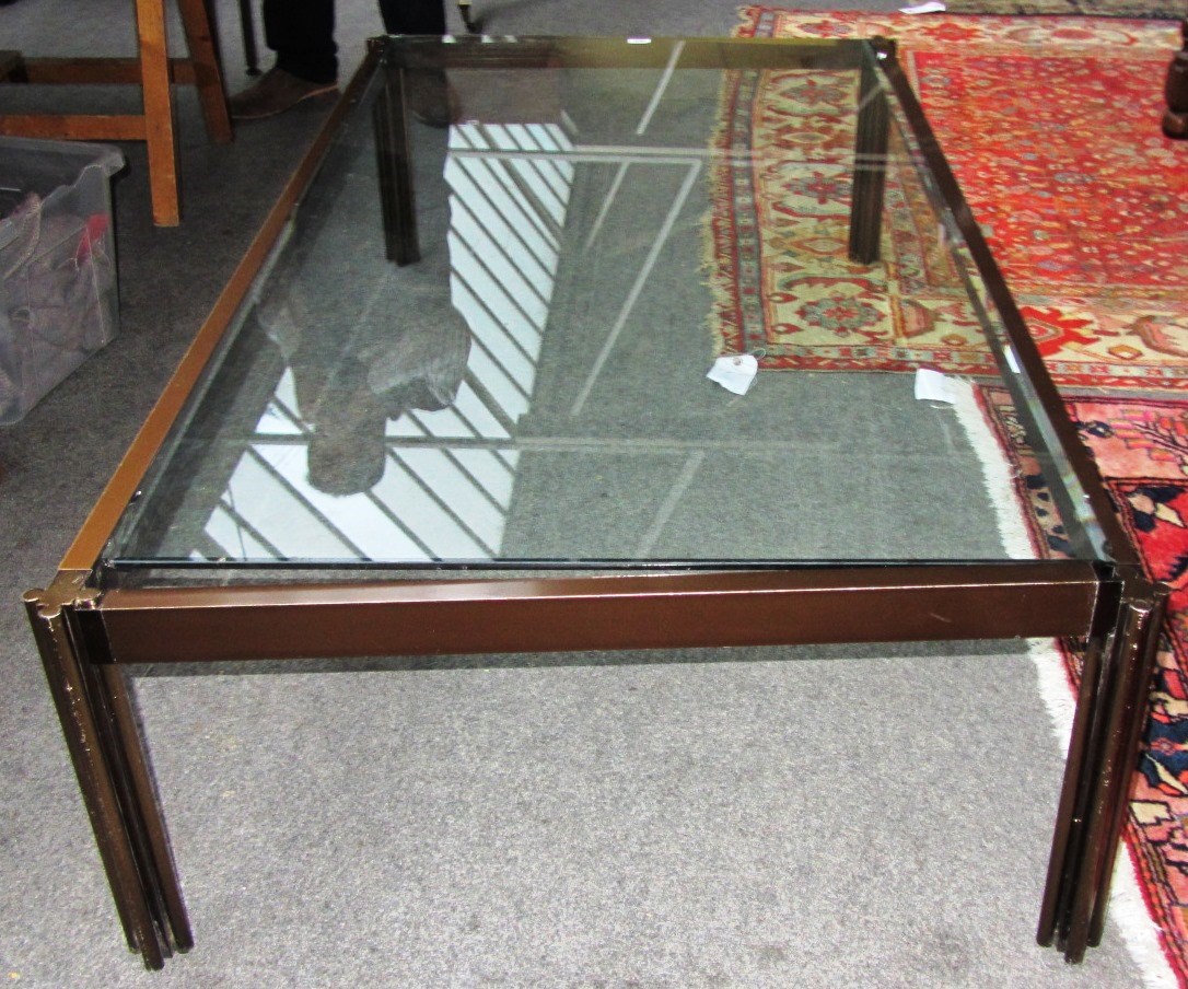 Appraisal: A large th century lacquered chrome glass top rectangular coffee