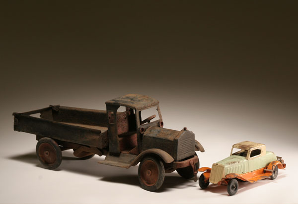 Appraisal: Pressed metal toys early dump truck and wind-up car Marx