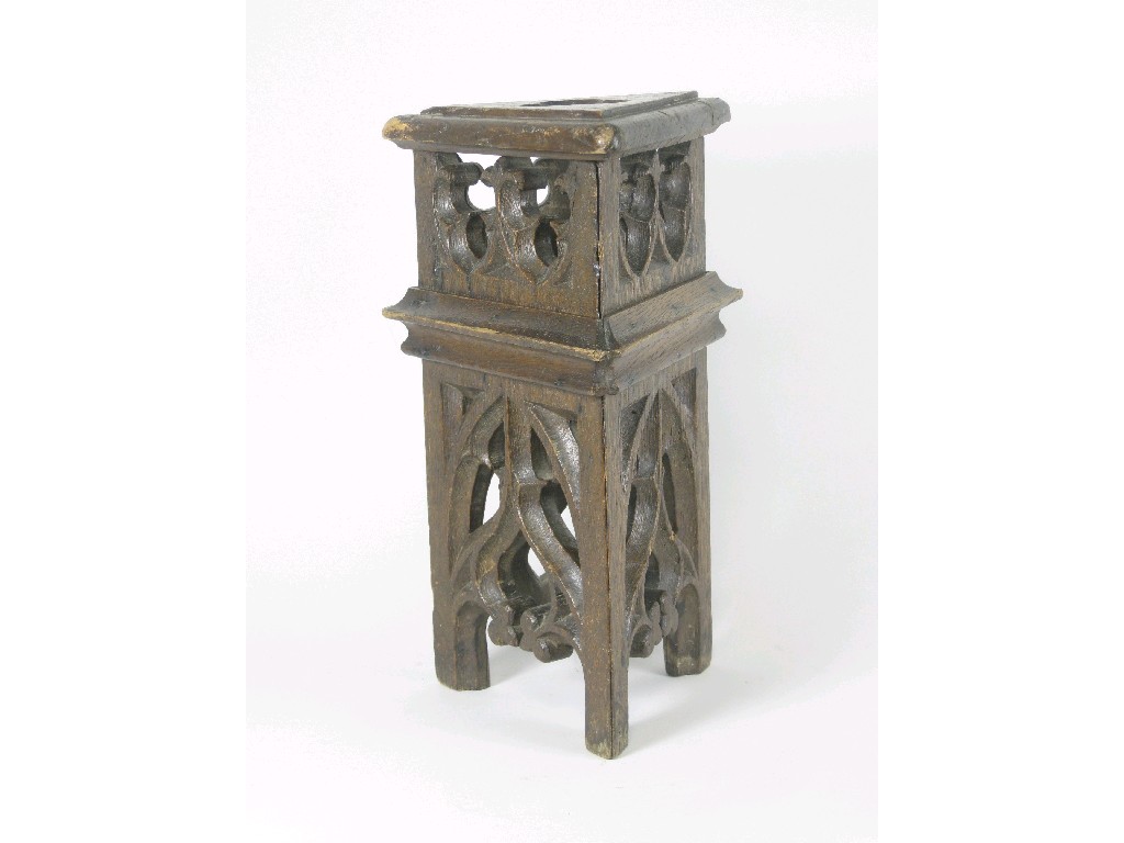 Appraisal: A Victorian Gothic oak triangular Stool with pierced top and