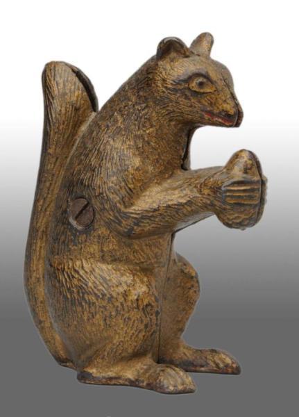 Appraisal: Cast Iron Squirrel with Nut Still Bank Description Manufactured in