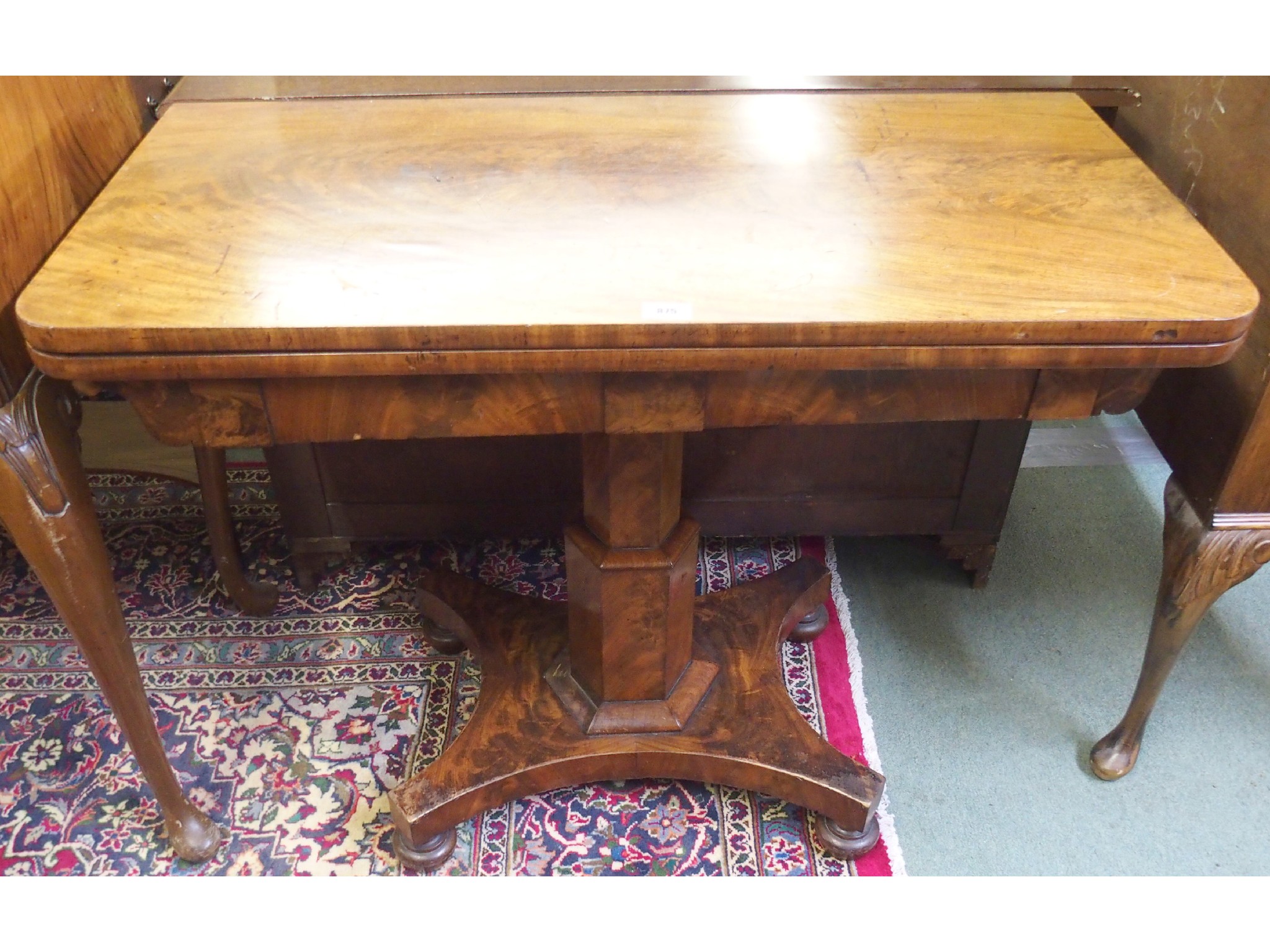 Appraisal: A Victorian mahogany fold over card table