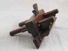 Appraisal: An early th Century fully adjustable wooden channel moulding plane