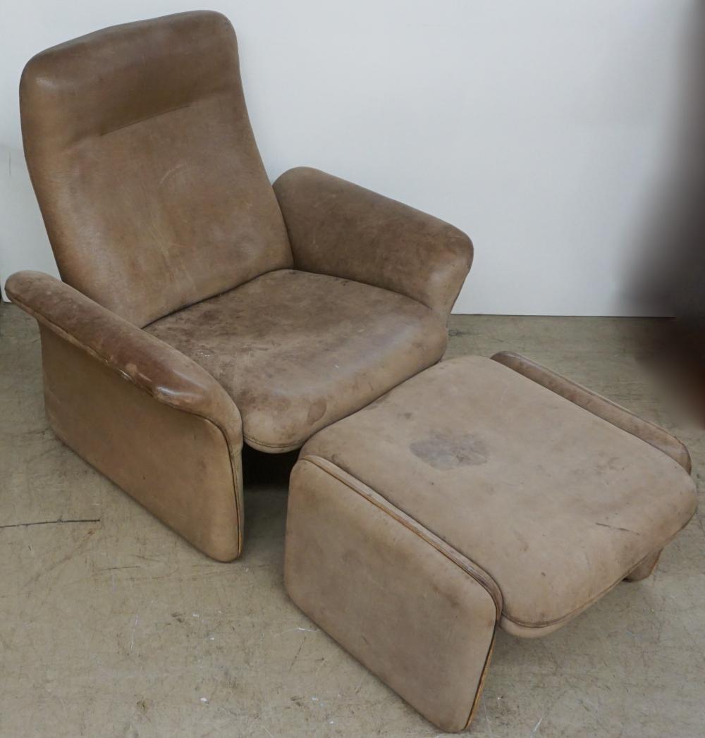 Appraisal: MID-CENTURY MODERN TAN LEATHER UPHOLSTERED LOUNGE CHAIR AND OTTOMANMid-Century Modern