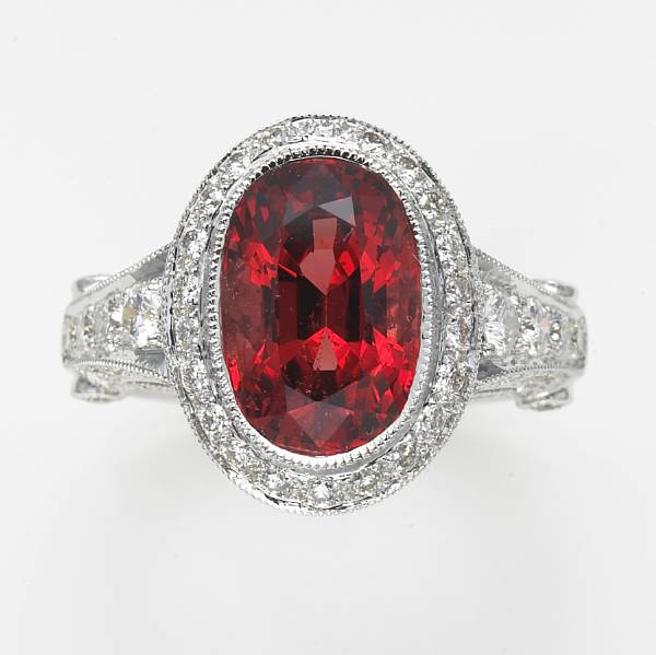 Appraisal: A pinkish-orange spinel diamond and k white gold ring spinel