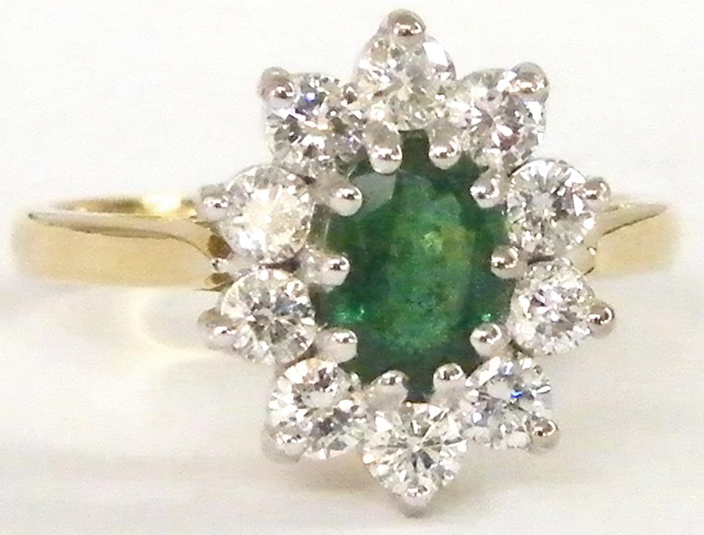 Appraisal: ct oval emerald and diamond ring the central emerald of