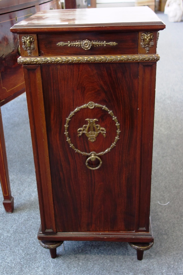 Appraisal: A gilt metal mounted goncalo alves Empire style side cabinet