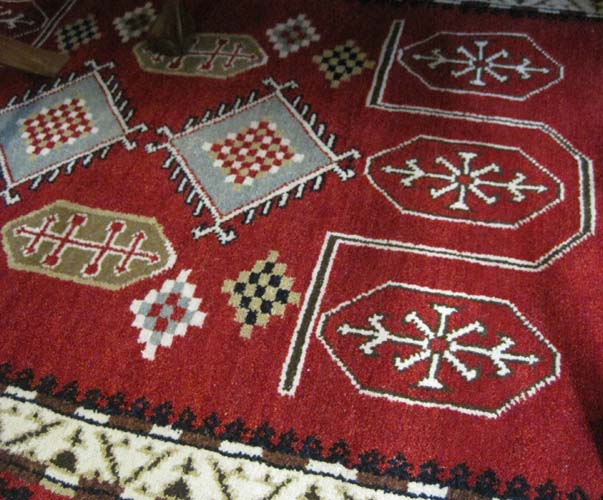 Appraisal: HAND KNOTTED ORIENTAL AREA RUG Indo-Kazak tribal overall geometric pattern