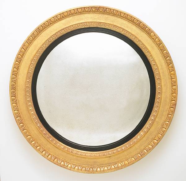 Appraisal: A Regency style carved giltwood convex mirror modern diameter in