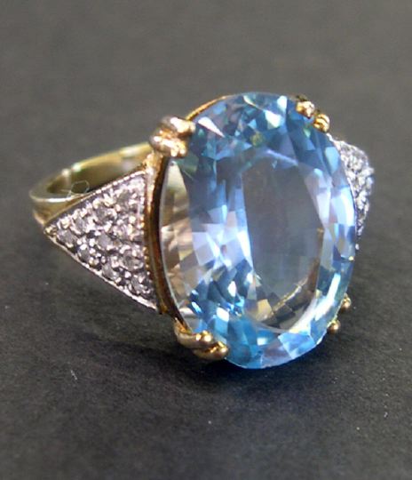 Appraisal: Fourteen-Karat Yellow Gold Blue Topaz and Diamond Ring containing one