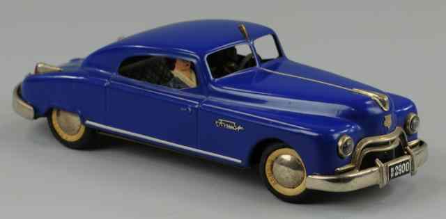 Appraisal: ARNOLD FORMAT Blue tinplate auto with driver clockwork driven rubber