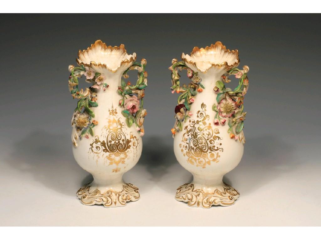 Appraisal: A PAIR OF CONTINENTAL PORCELAIN BALUSTER VASES on leaf-moulded pedestal