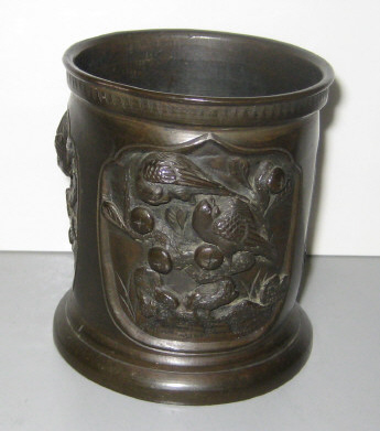 Appraisal: JAPANESE BRONZE CUP Decorated with three molded medallions depicting various