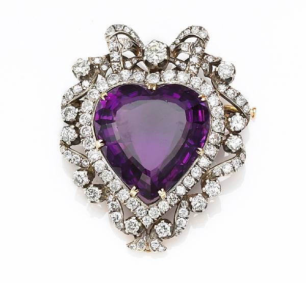 Appraisal: An amethyst and diamond brooch-pendant centering a heart-shaped amethyst estimated