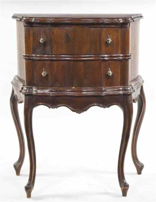 Appraisal: An Italian Mahogany Diminutive Commode having a shaped rectangular top