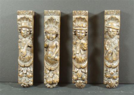 Appraisal: A group of four carved oak caryatids each of a