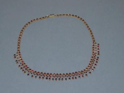 Appraisal: A VICTORIAN GARNET NECKLACE comprising a fringe of round cut