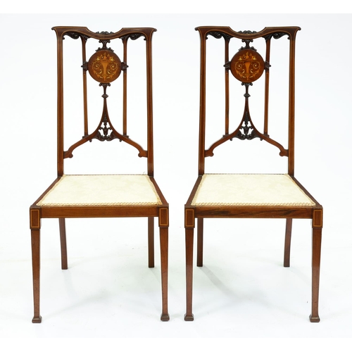 Appraisal: A pair of carved and inlaid mahogany bedroom chairs height